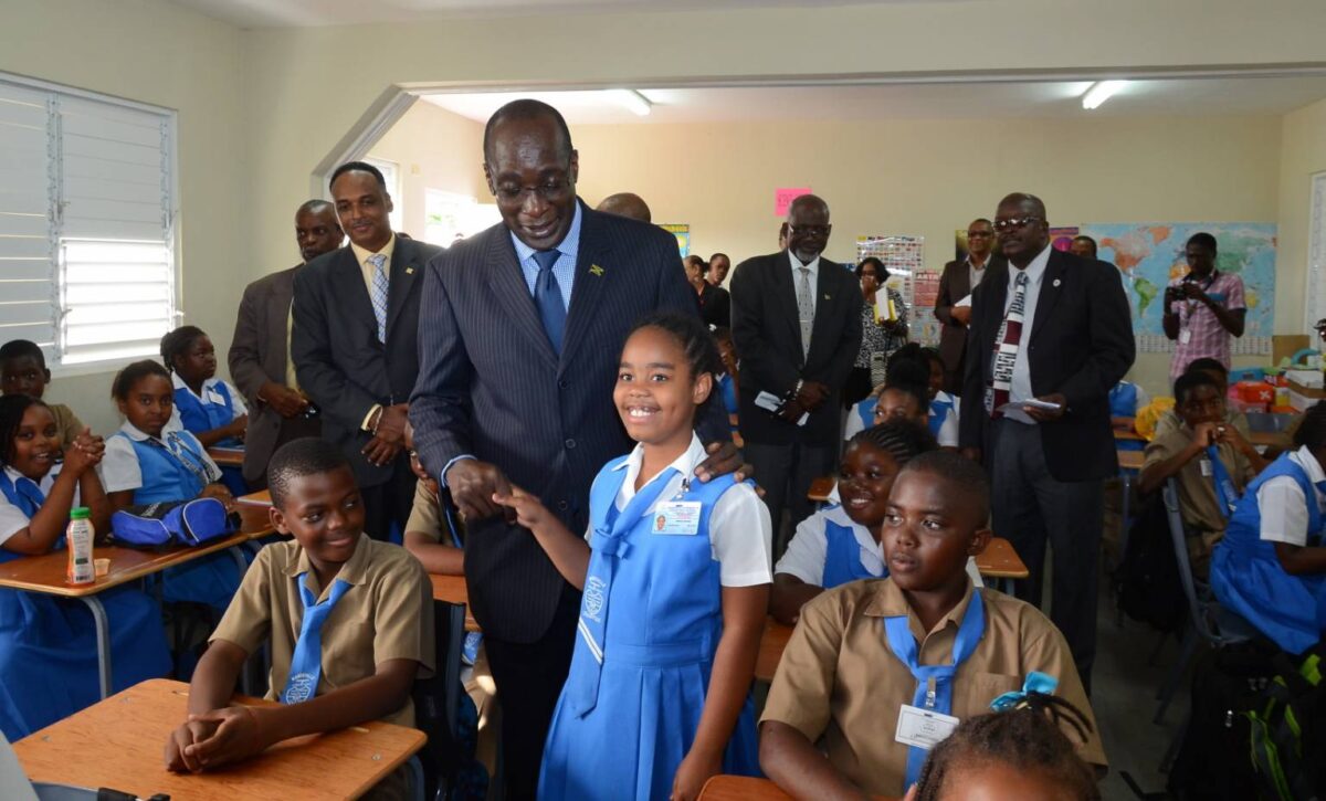 Mandeville Primary School student and education officials at the school